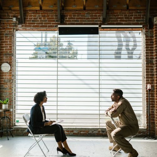 A therapist and soldier in a mental health session, reflecting support and recovery.
